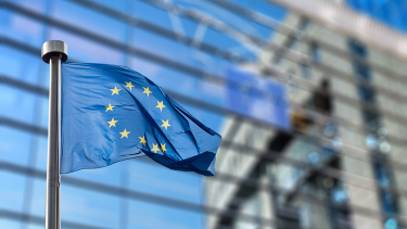 adobestock_93494284_eu_flag_outside_commission_building-950px