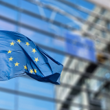 adobestock_93494284_eu_flag_outside_commission_building-950px
